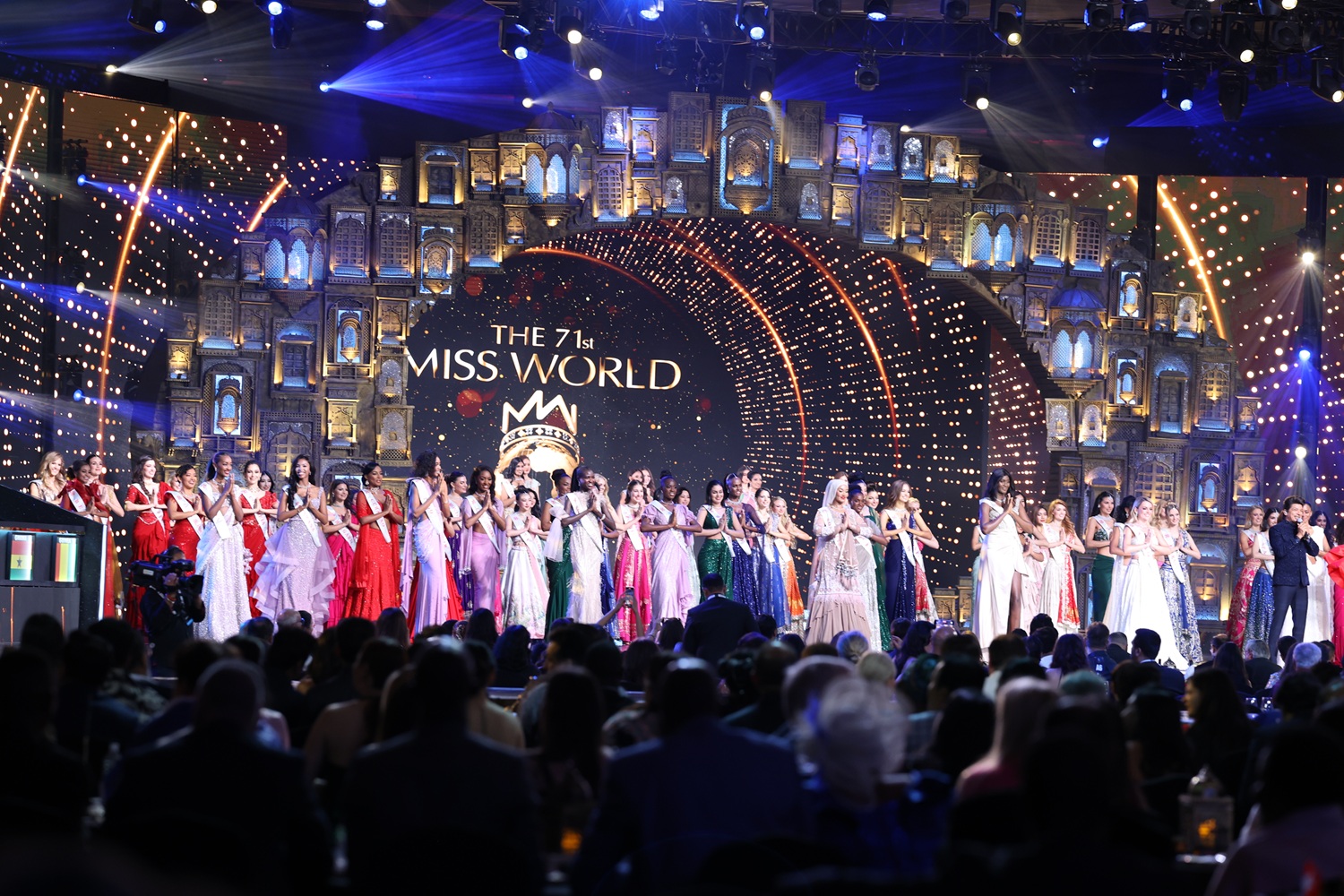 Shaan on stage with the 71st Miss World contestants