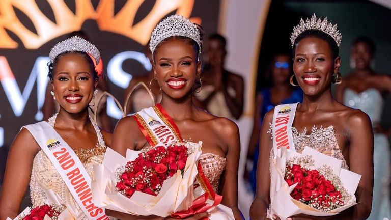 Miss Uganda 2026 Almorie Nagayi smiling with her crown alongside the pageant's runners-up